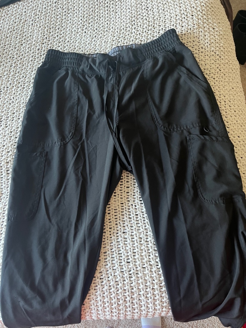 Black scrub pants.